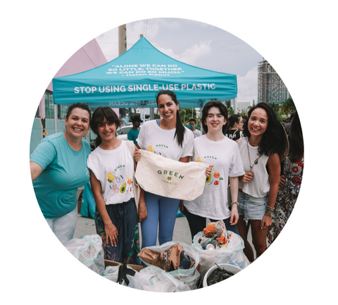 Green Tomato Market team promoting sustainable living and reusable bags at a community event in South Florida